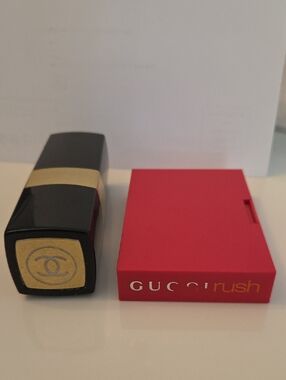 CHANEL Black & Gold Perfume Bottle with GUCCI Perfume Bottle.